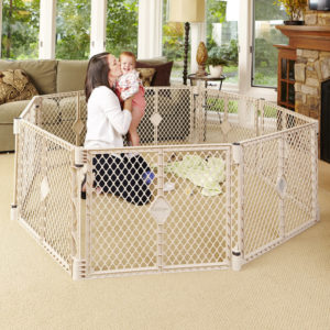 mom and her baby inside of baby's cradle