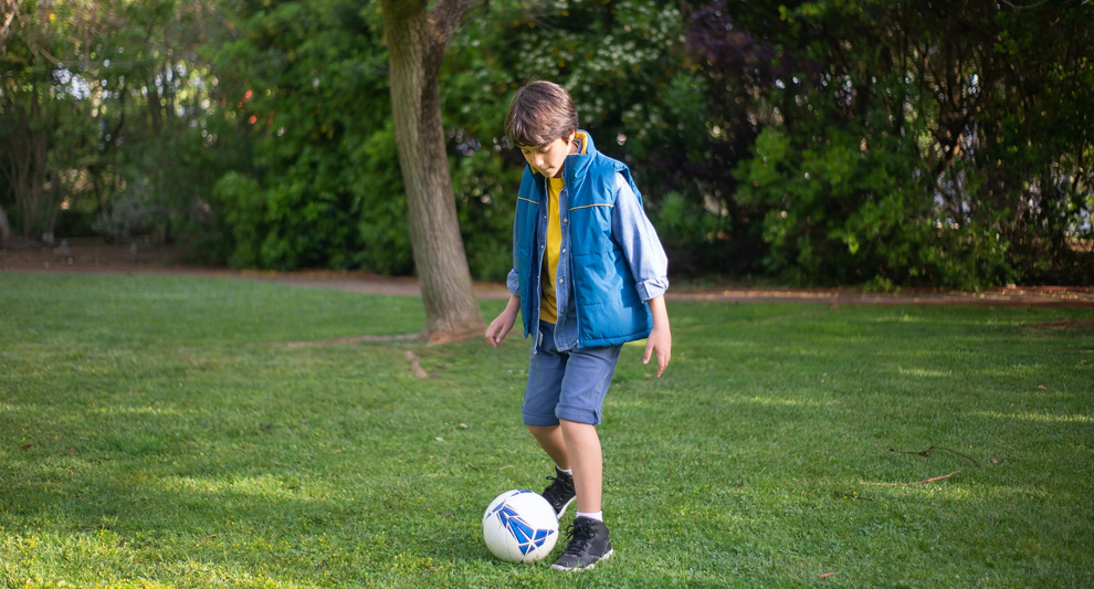 a kid playing soccer